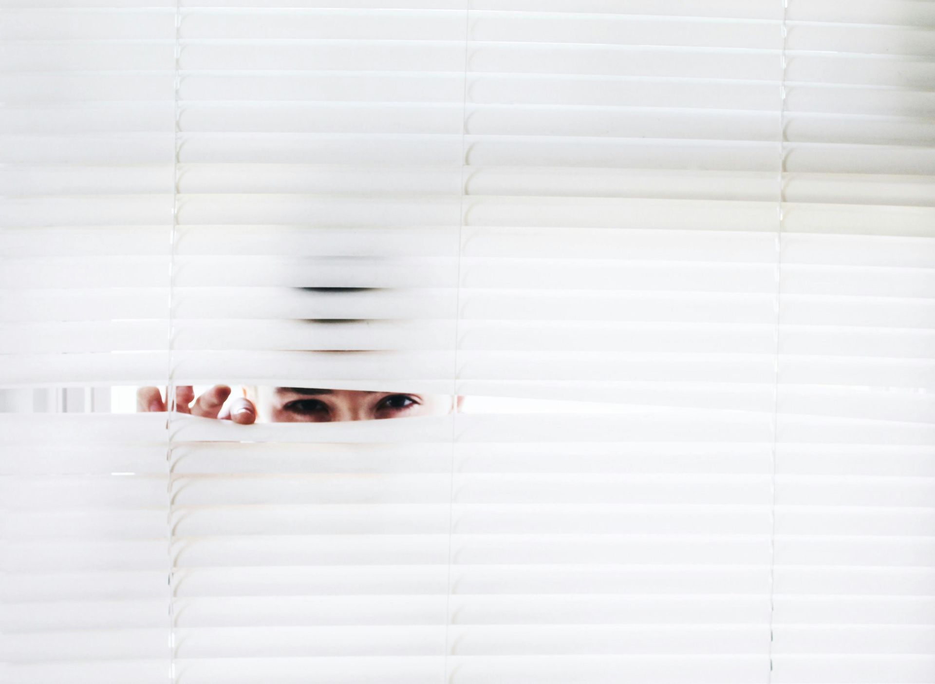 A close-up of a person peeking through partially opened window blinds, symbolizing data privacy, security, and confidentiality. Represents the Privacy Policy section outlining the protection and processing of personal data by Lifestyle Supplies BV. A close-up of a person peeking through partially opened window blinds, symbolizing data privacy, security, and confidentiality. Represents the Privacy Policy section outlining the protection and processing of personal data by Lifestyle Supplies BV.